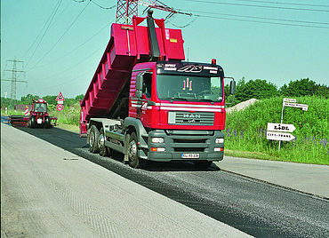 Asphalt is being tipped out of a lorry