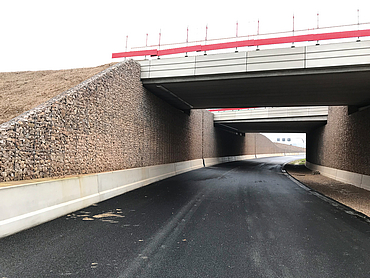 Road underpass with stone walls