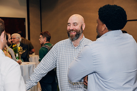 Engineering professionals networking during a GeoForum event