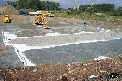 Stabilenka is being covered with gravel using an excavator