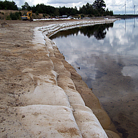 Close-up of SoilTain Bags as coastal protection at the lake's edge.