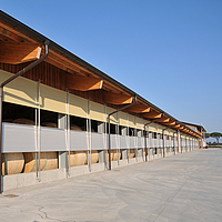 Storage hall with Lubratec double WLU system to protect hay bales from the weather