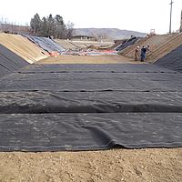 Installing Ultimat nonwoven geotextile in canal