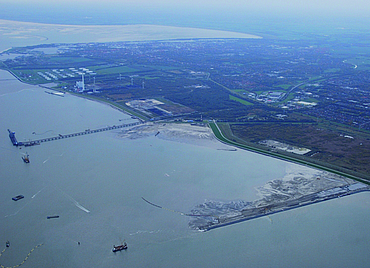 Aerial view of the boundary along the riverbank of a large site.