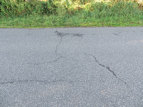 Close-up of cracks in the road