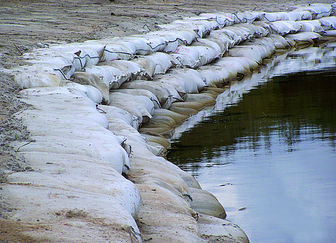 Filled SoilTain Bags on a riverbank