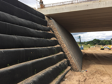 Construction of the steep walls beneath a bridge