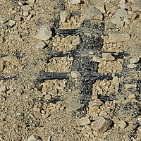 Close-up view from above: Fortrac geogrid covered with gravel to reinforce the soil