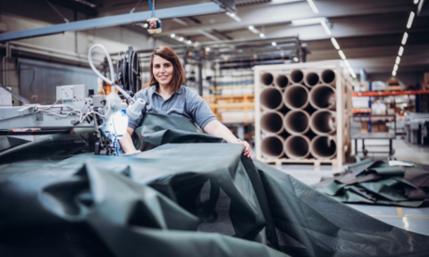 HUESKER employee works with a material