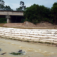 Sandbags at the river edge for bank protection