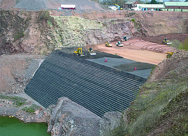 Aerial view of the large construction site with some construction machinery
