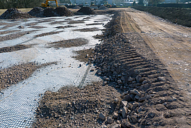 Installation of geosynthetics for road construction for soil stabilization