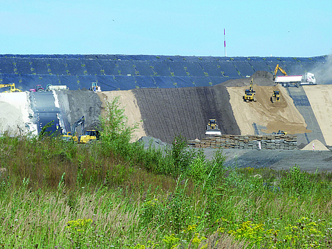 Construction site at a landfill site with construction machinery